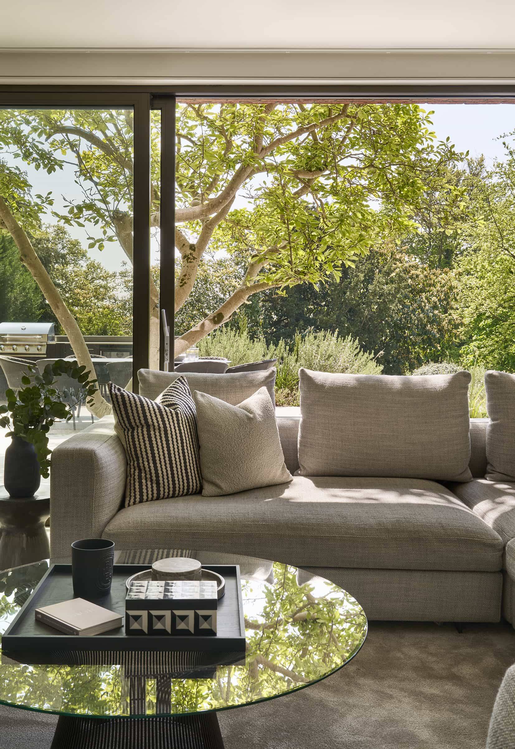 Bright, sun-drenched living room shoot location with panoramic views of mature gardens in Chislehurst, Love Locations.