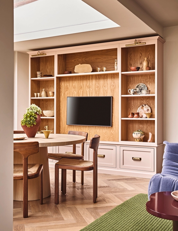 Custom wooden wall cabinetry featuring an integrated TV housing unit and dining area, Love Locations SE21.