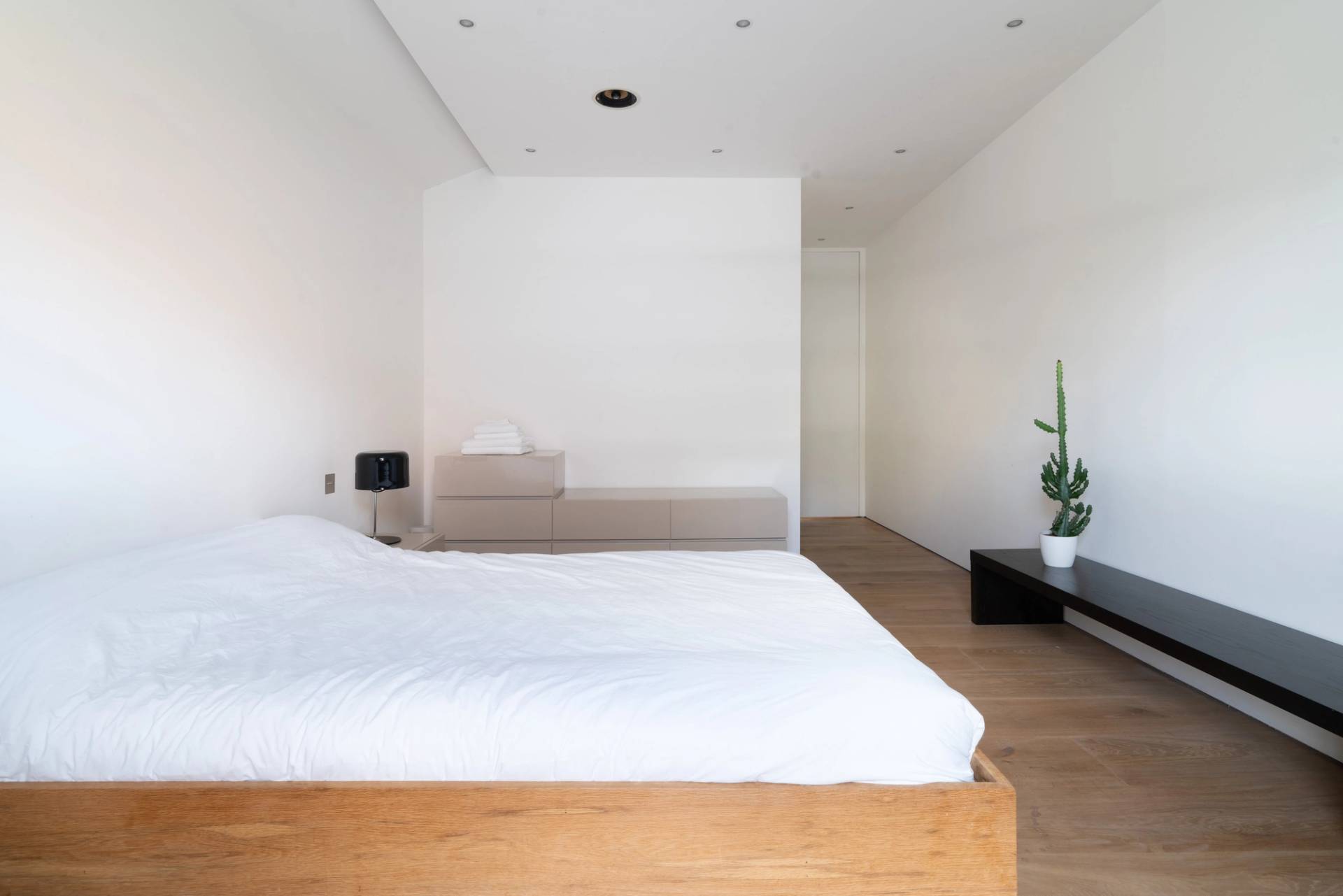 Subterranean home cinema and gym suite featuring a large projection screen and workout equipment, Love Locations SW6.