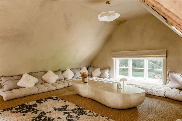 Attic lounge with vaulted ceiling and sculptural seating at a character property in Liss, Hampshire GU33 – Love Locations filming location.