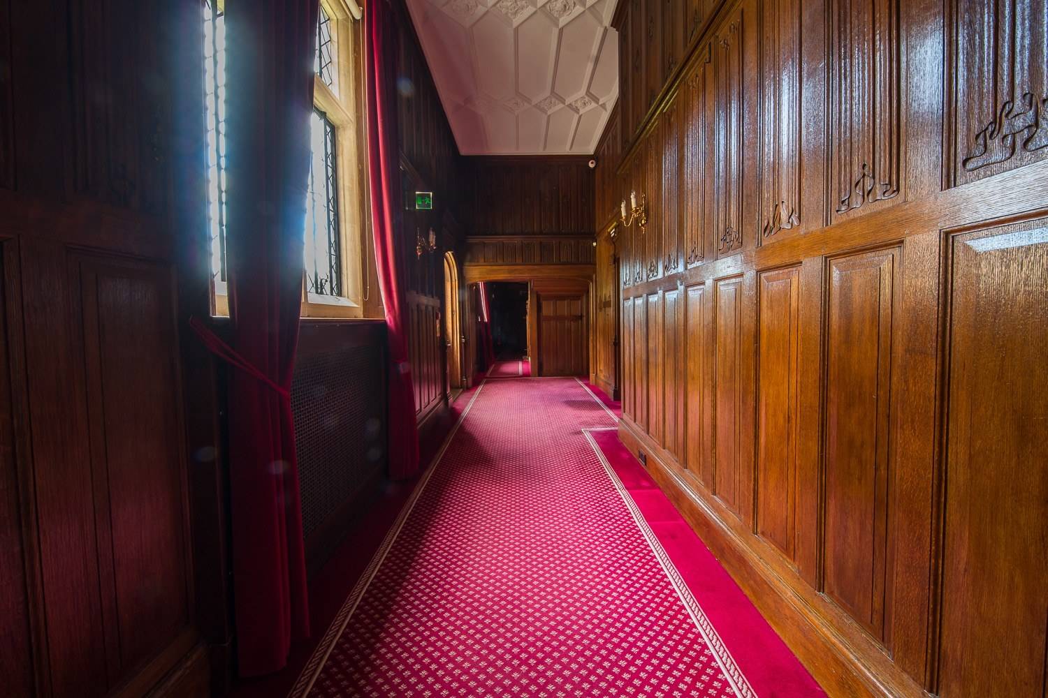 Grand wood-panelled corridor and hallway shoot location in a Hertfordshire Elizabethan manor house by Love Locations.