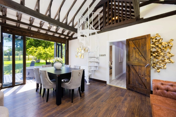 Contemporary barn conversion with timber beams in RM4 – Love Locations