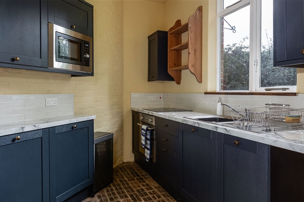 Compact contemporary kitchen with modern appliances at Love Locations house in Liss, Hampshire GU33.
