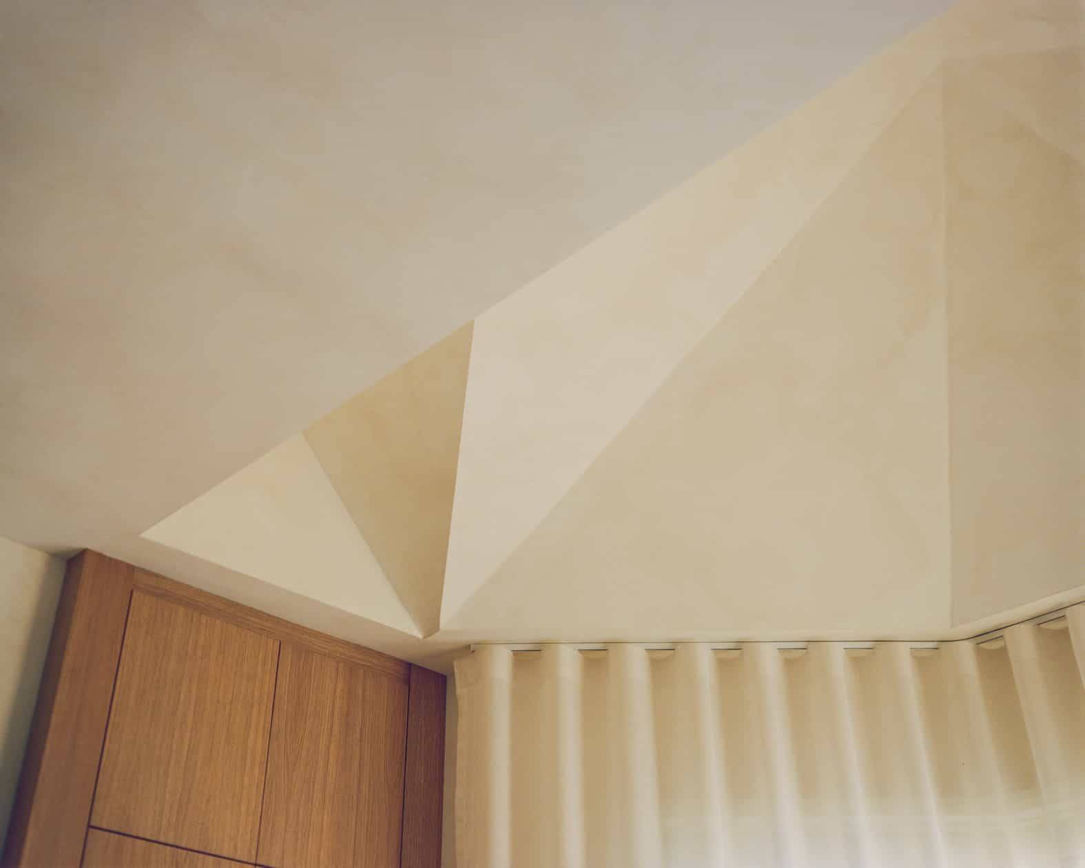 Geometric plaster ceiling detail meeting sheer wave curtains and custom oak joinery, Love Locations SW4.