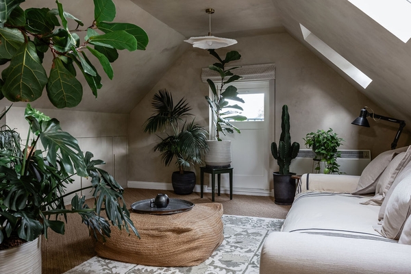 Spacious loft lounge with vaulted ceilings and feature coffee table at Love Locations property in Liss, Hampshire GU33.