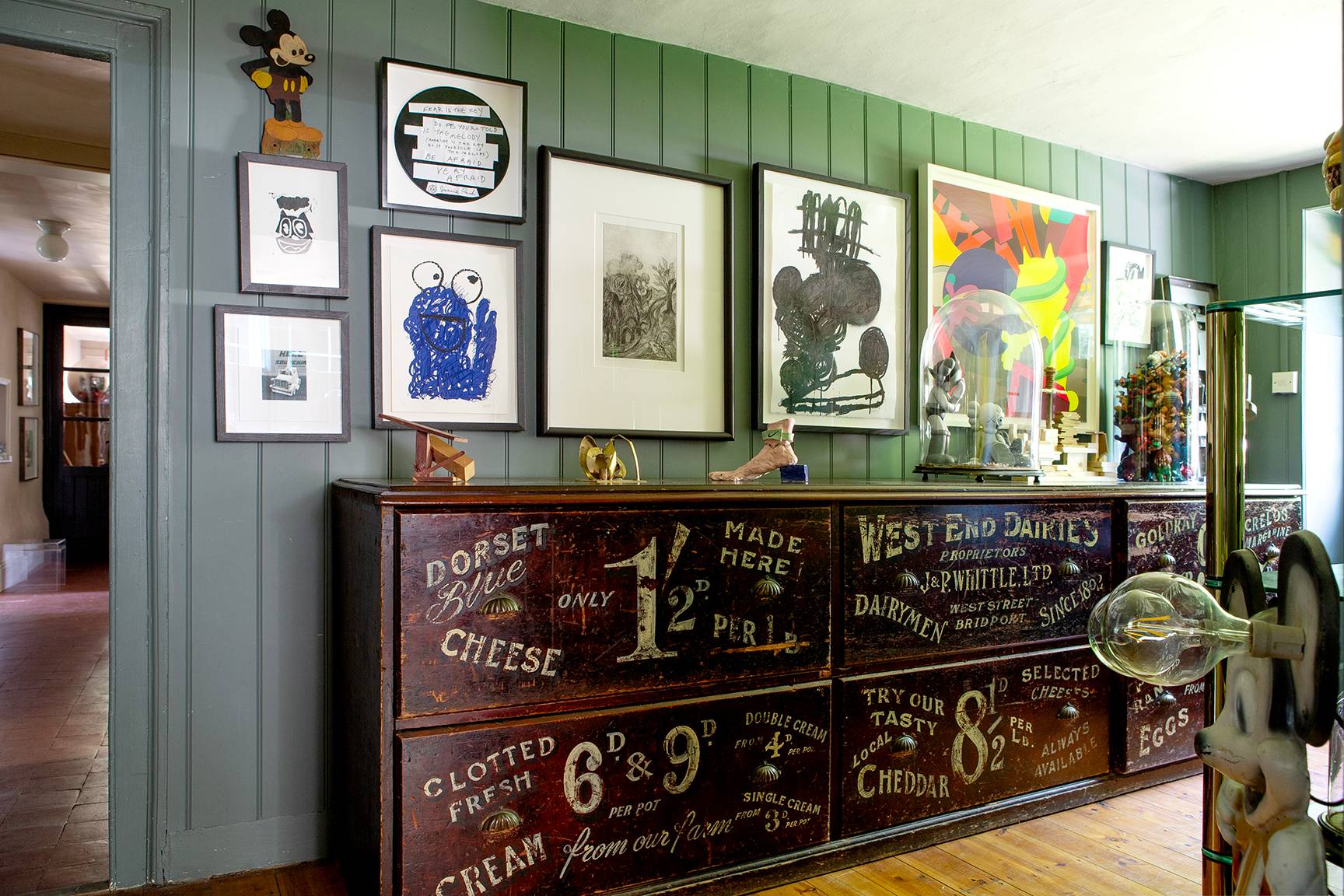 Green panelled hallway alcove featuring a vintage black chalk menu board and framed artwork, Love Locations ME13.