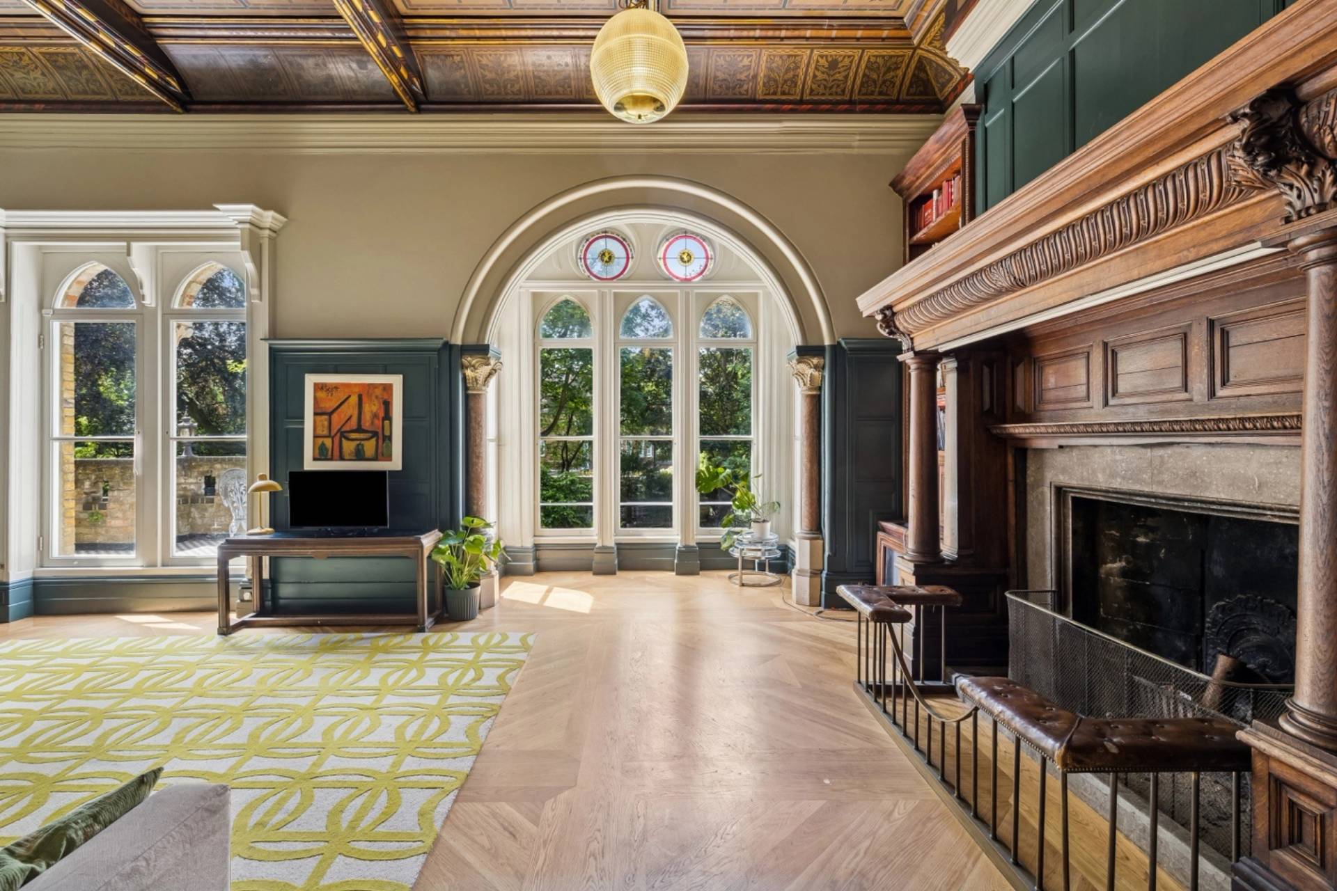 Light-filled library room featuring a stained glass arched window bay in Hampstead NW3 from Love Locations.