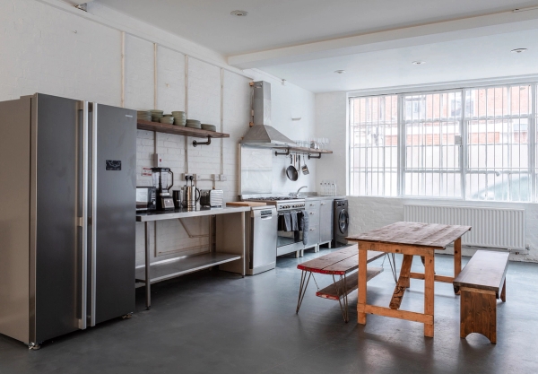 Spacious industrial kitchen event space with professional appliances at Brixton Warehouse Love Locations.