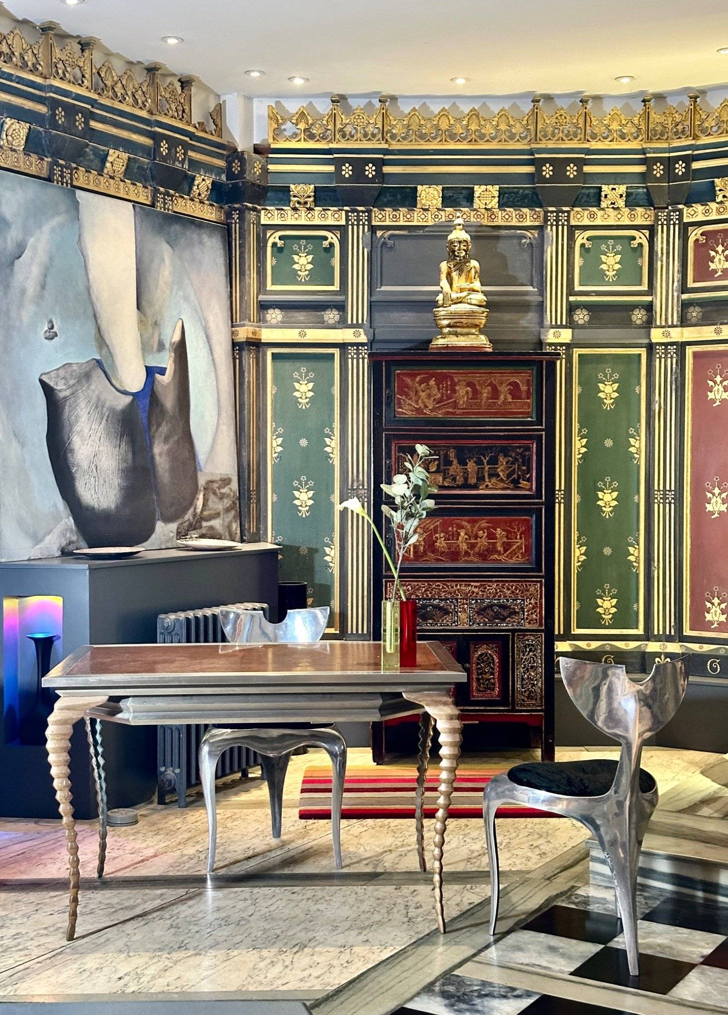 Decorative antique cabinet and Buddha artwork detail inside a converted chapel film location in Oval SE5 via Love Locations.