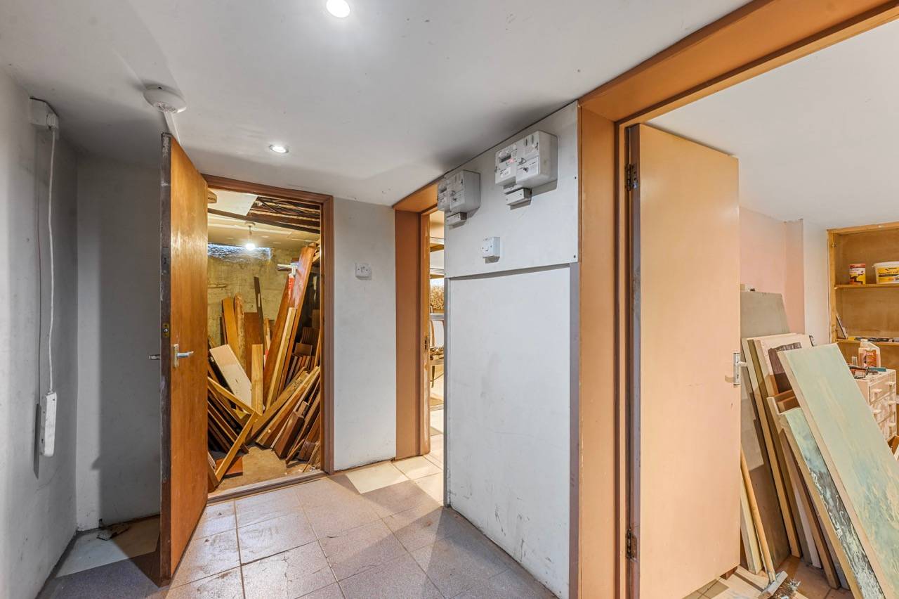 Workshop or prop storage room with pine timber door frames and bright lighting, Love Locations.