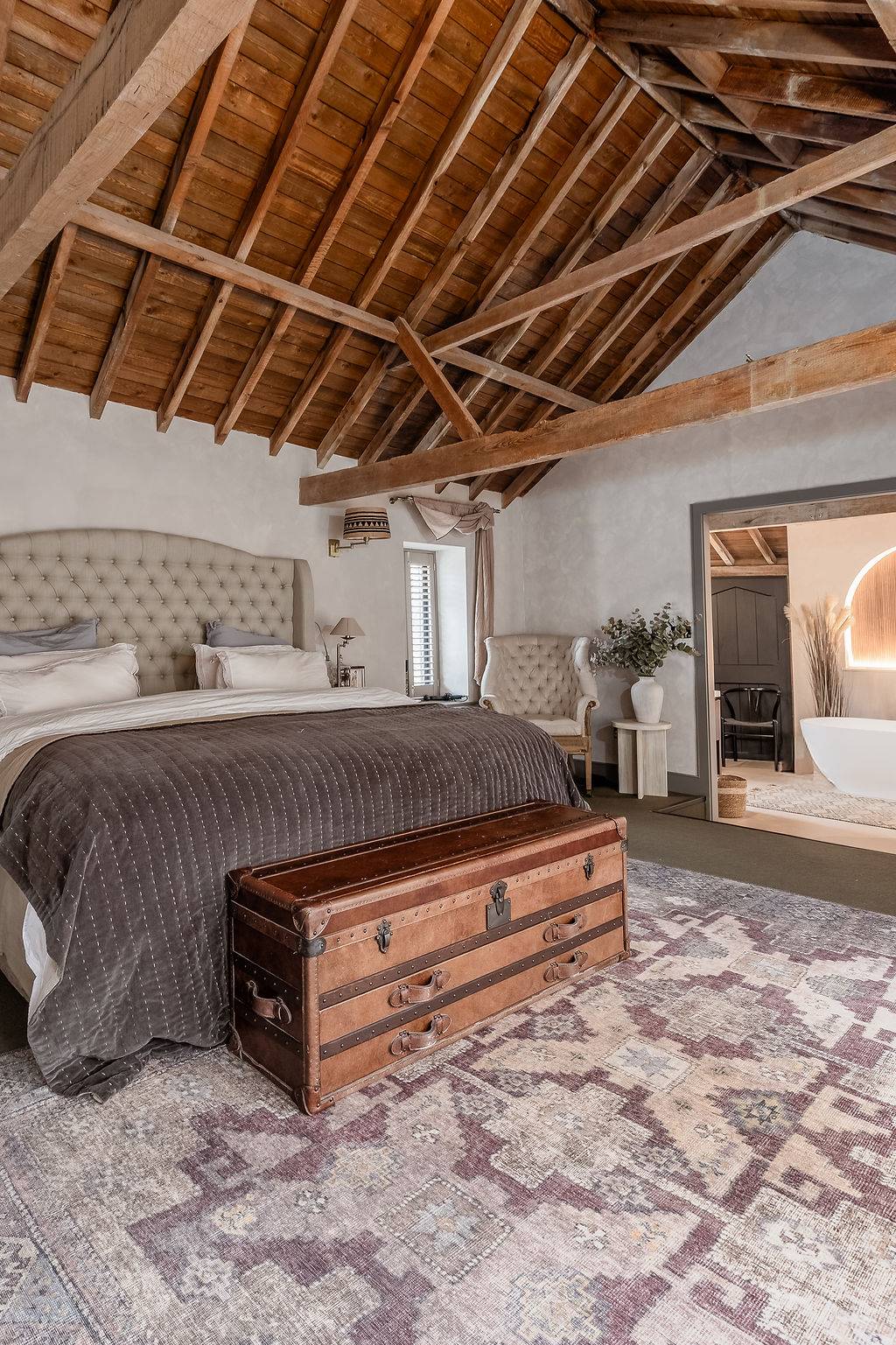 Minimalist furniture in a rustic Petersfield barn by Love Locations.