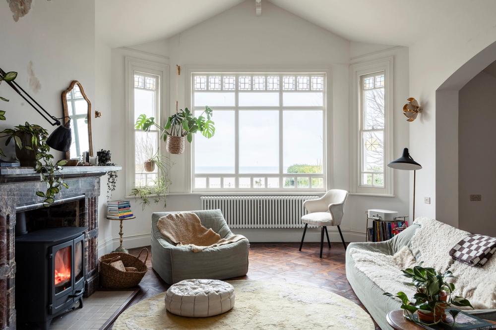 Beautiful light white textured walls within victorian seaside home .