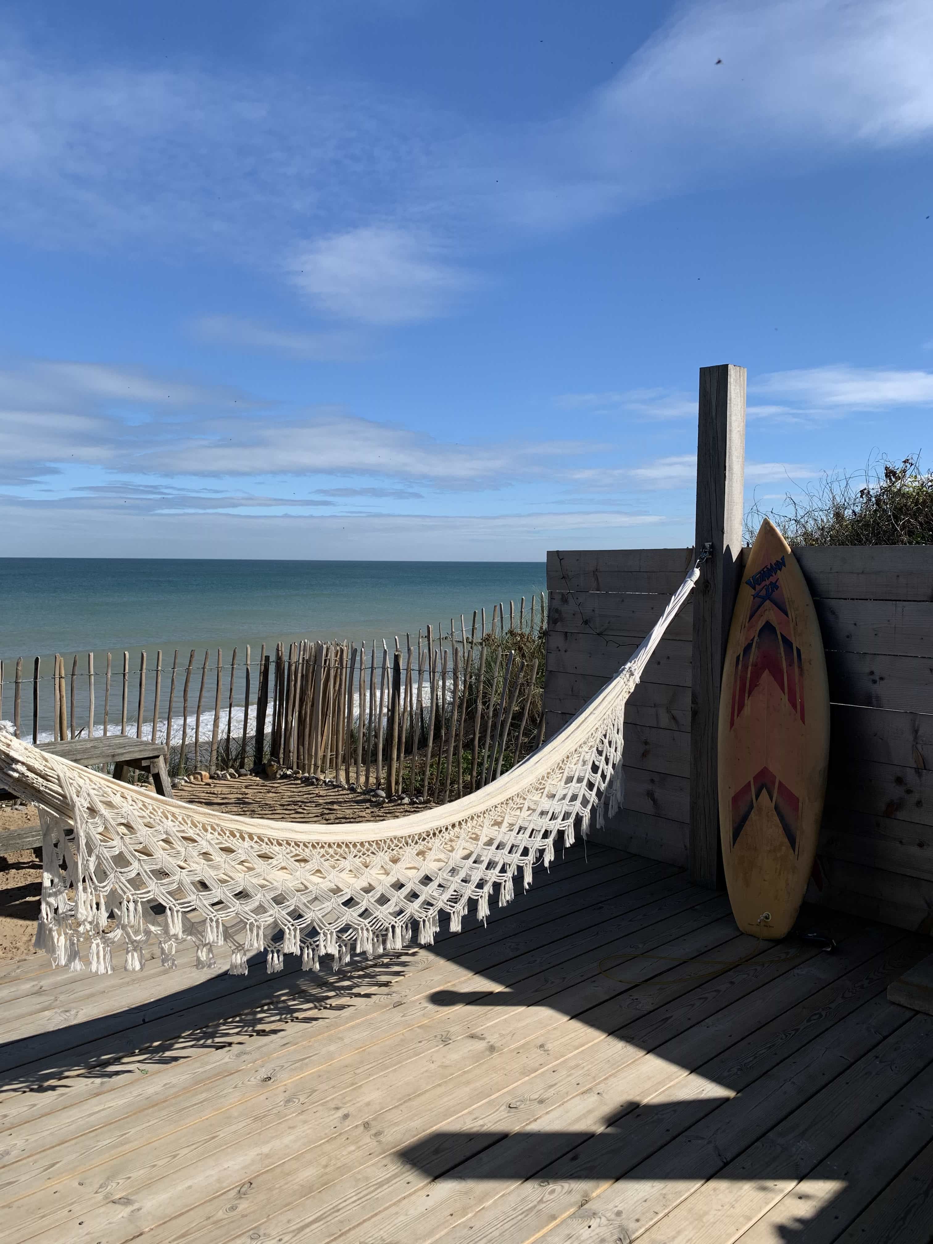 Hammock on wooden beach deck at Norfolk Beach House, overlooking the Norfolk coastline – ideal for lifestyle and summer shoot settings.