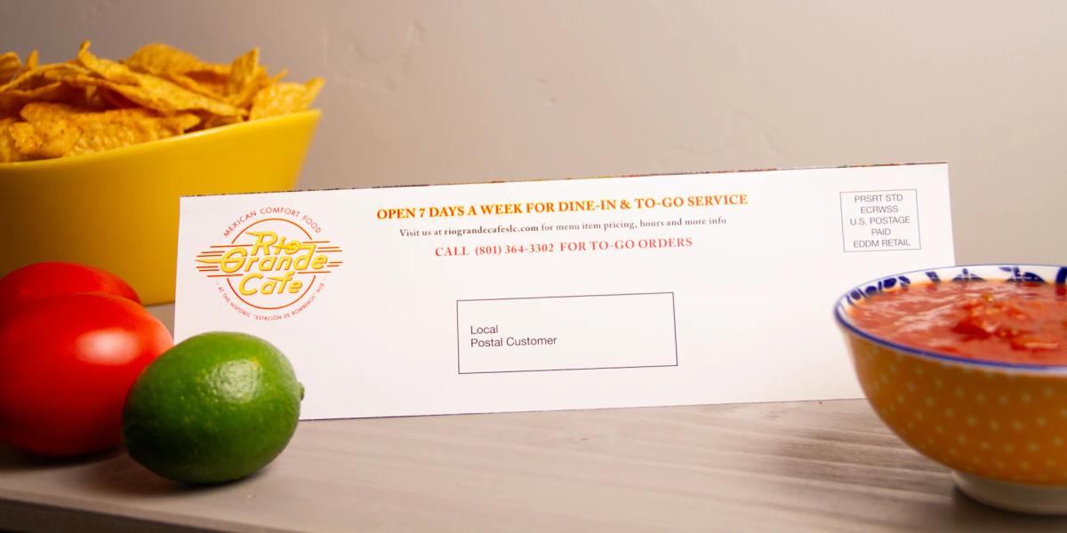 Addressed direct mail brochure prepared for mailing and fulfillment with printed postage and recipient information.