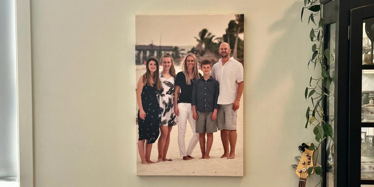 A gallery-wrapped canvas print featuring a family, displayed on a wall in a modern home.