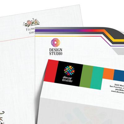 Custom business stationery set featuring branded letterheads with professional designs.