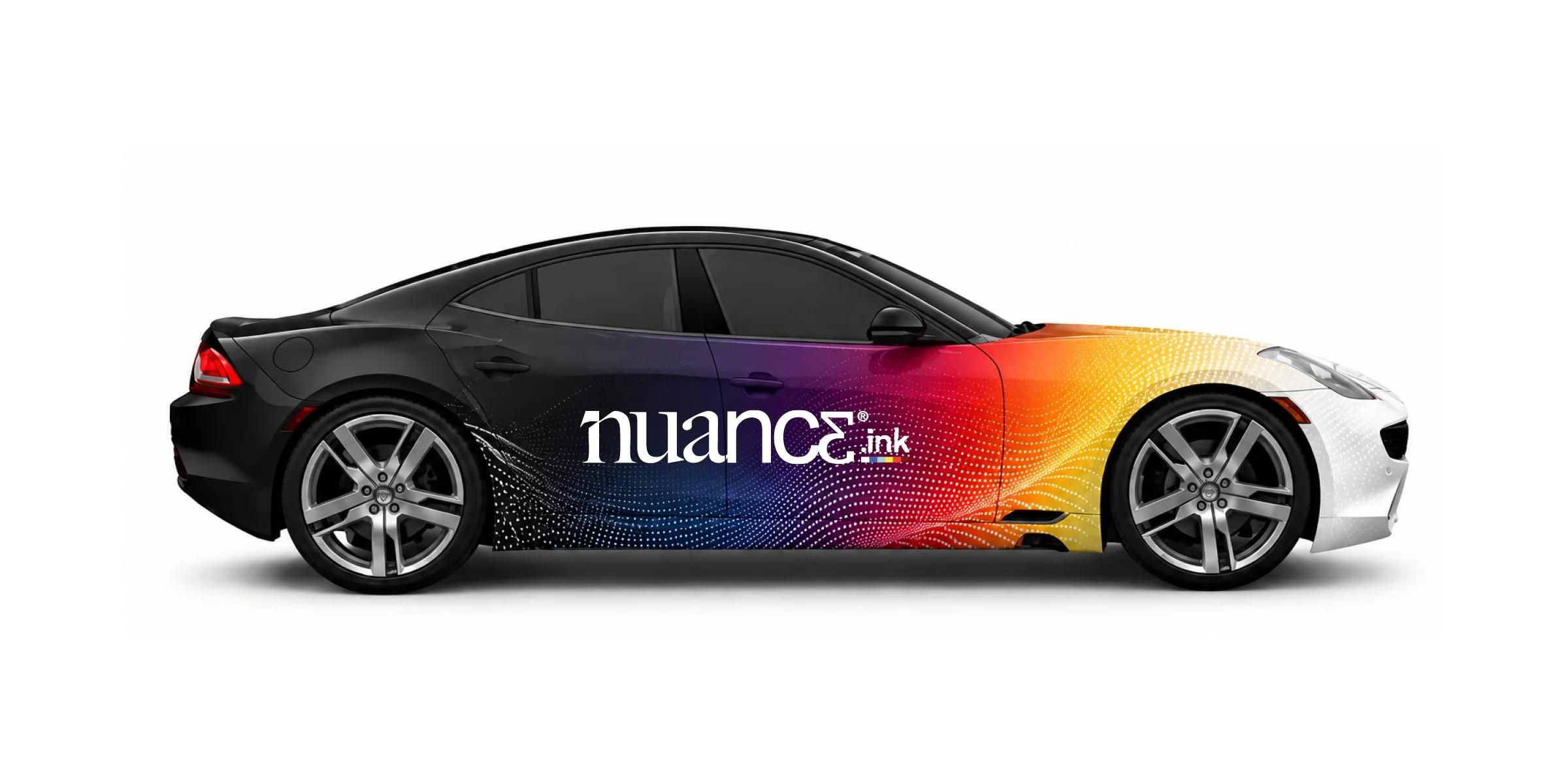 Black sports sedan featuring a vibrant full-color custom vehicle wrap with Nuance Ink branding on a white background.