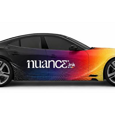 Black sports sedan featuring a vibrant full-color custom vehicle wrap with Nuance Ink branding on a white background.