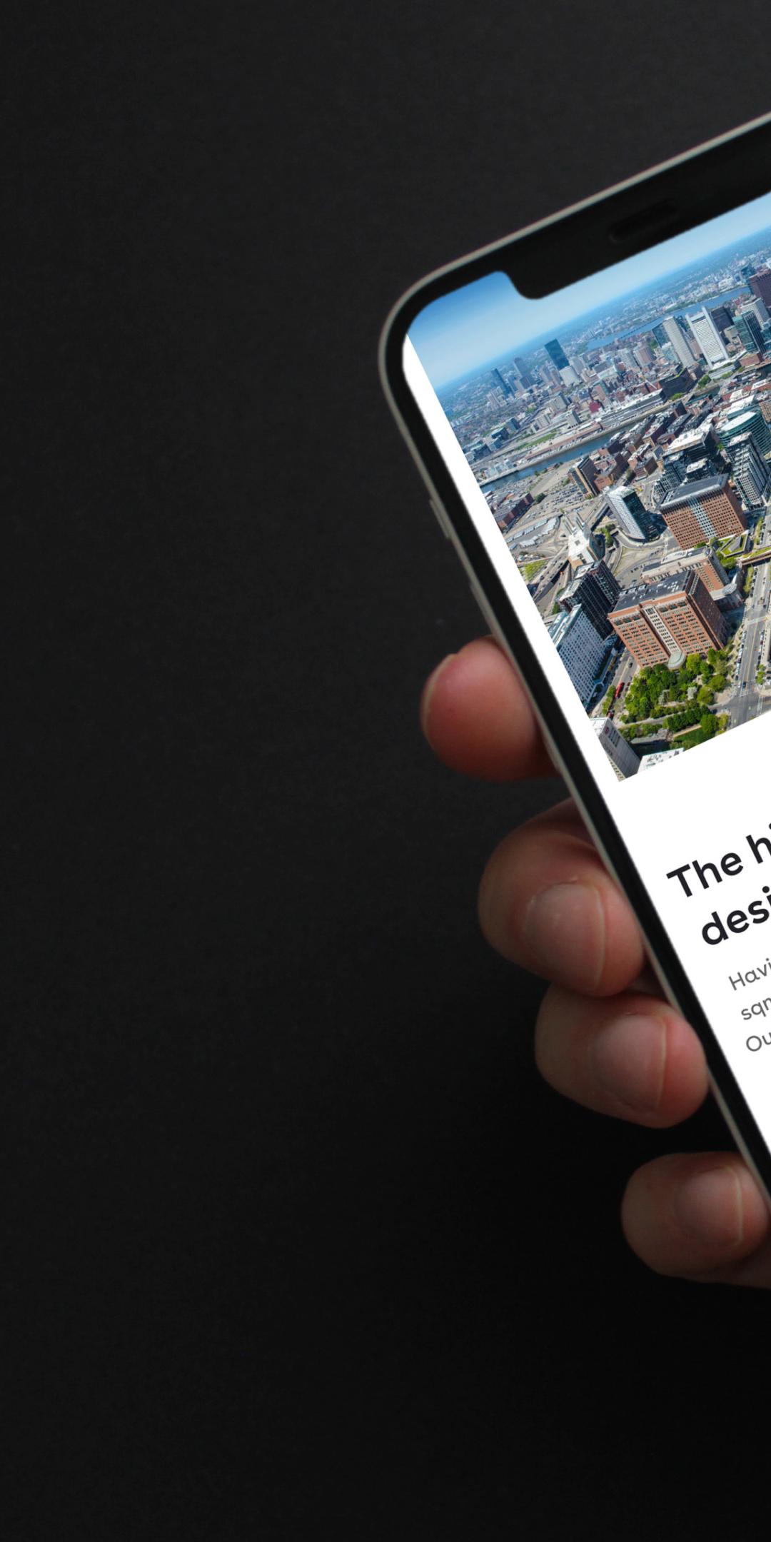 Pembroke website on a phone, showing an aerial city view and floor space figures, including "8.9m sqft" in total