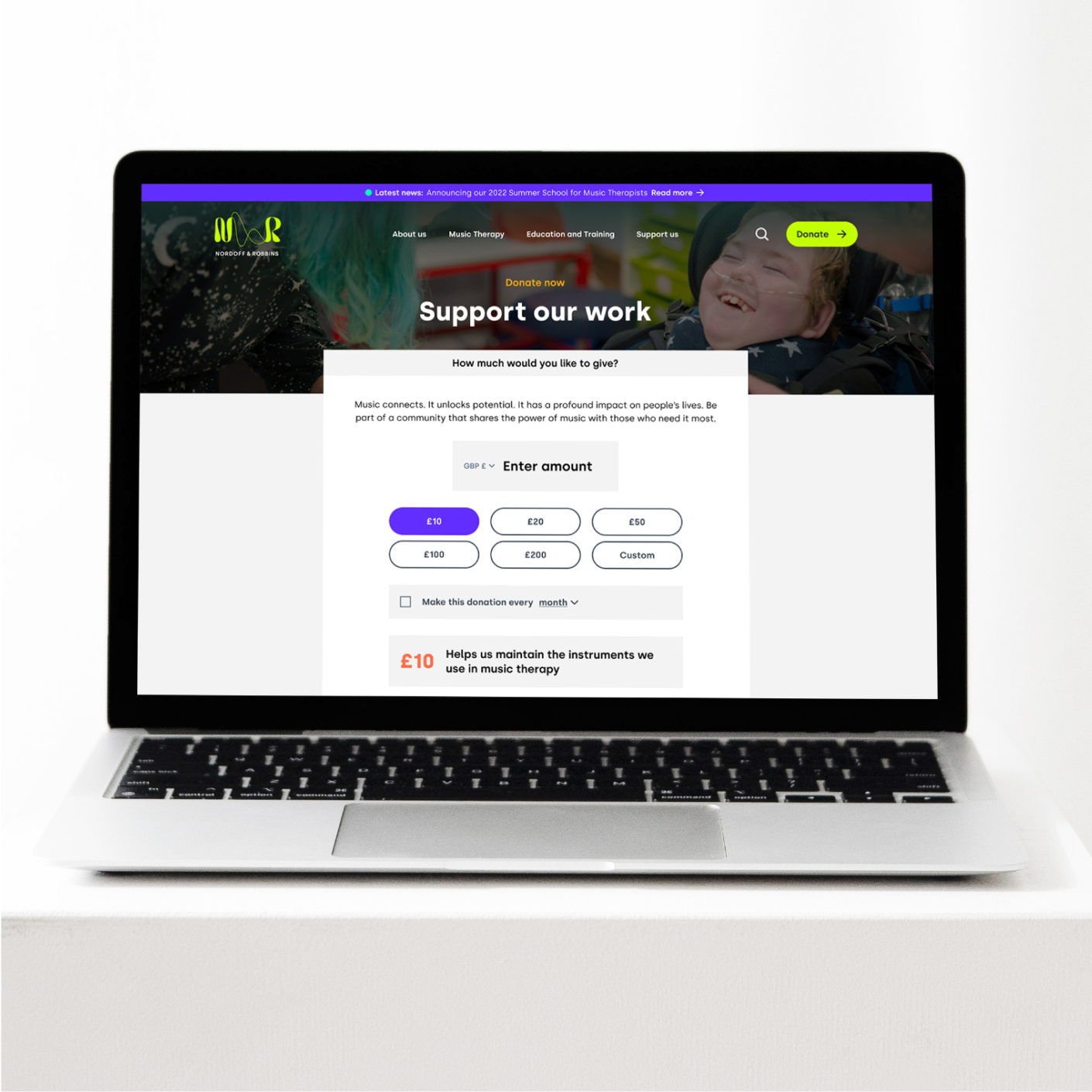Nordoff and Robbins "Support our work" donation page on a laptop, with gift amounts from £10 to £200