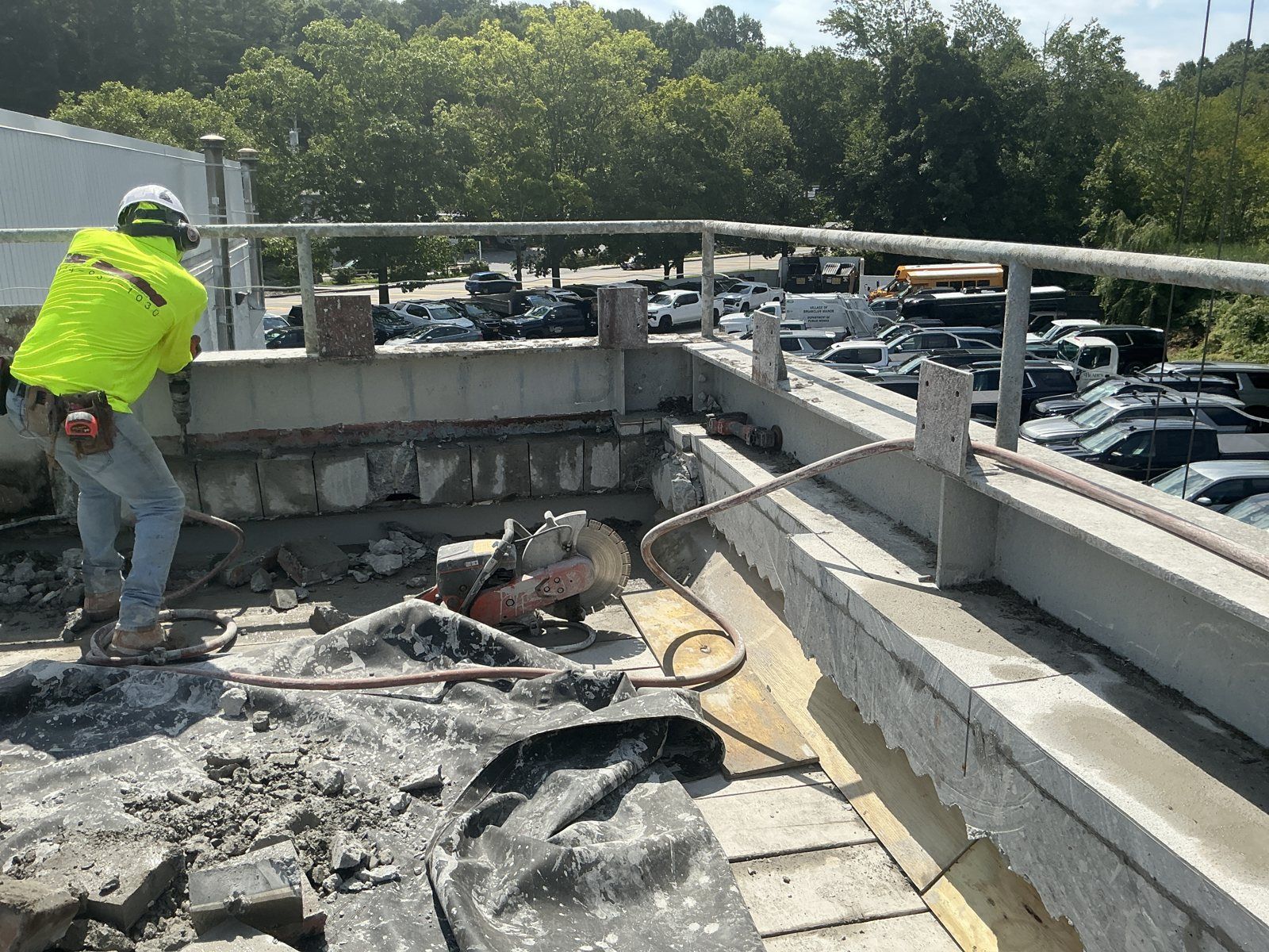 Cut-off saw work at the parapet where the slab meets the curb