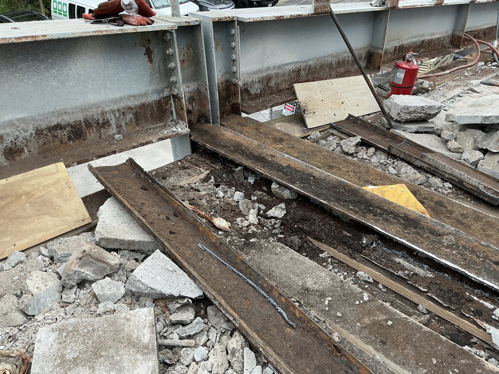 Existing beam and girder connections exposed for replacement