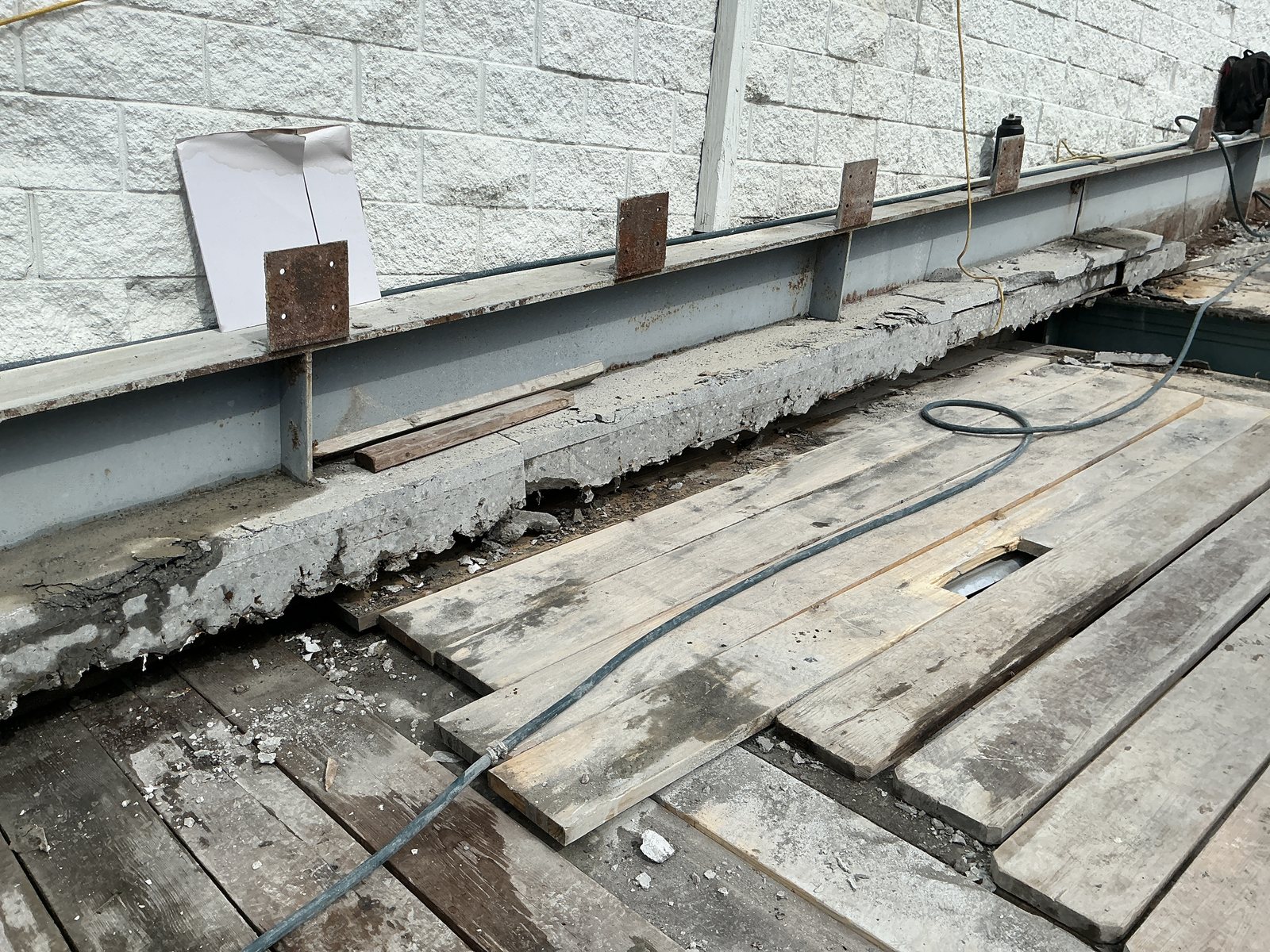 Deck removed to the supporting steel, protection decking below