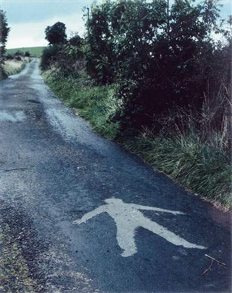 A good short shower of rain wetting the road but not enough to run