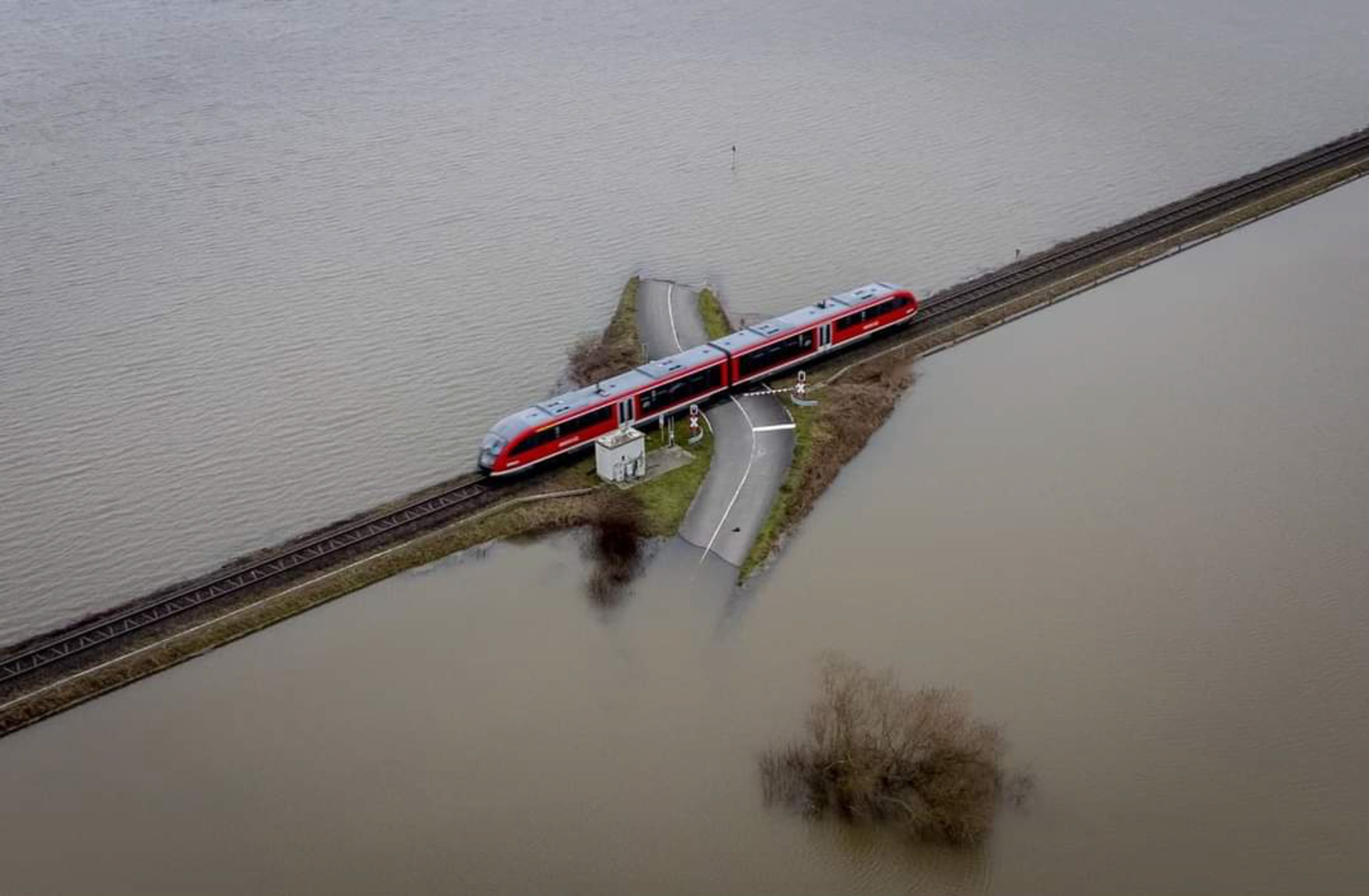Unknown (a train passes over a railroad crossing)