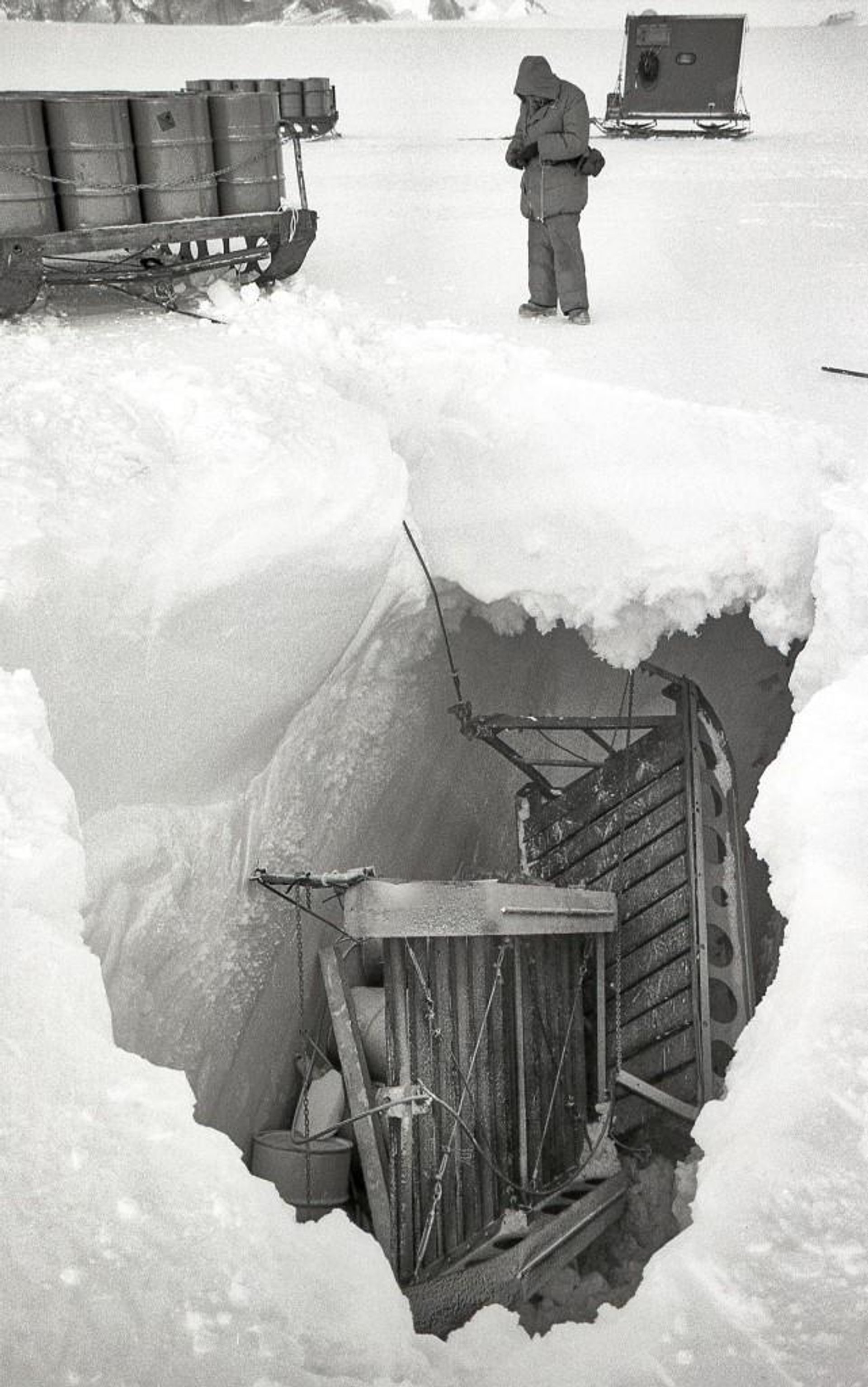 Ross standing above slotted sleds