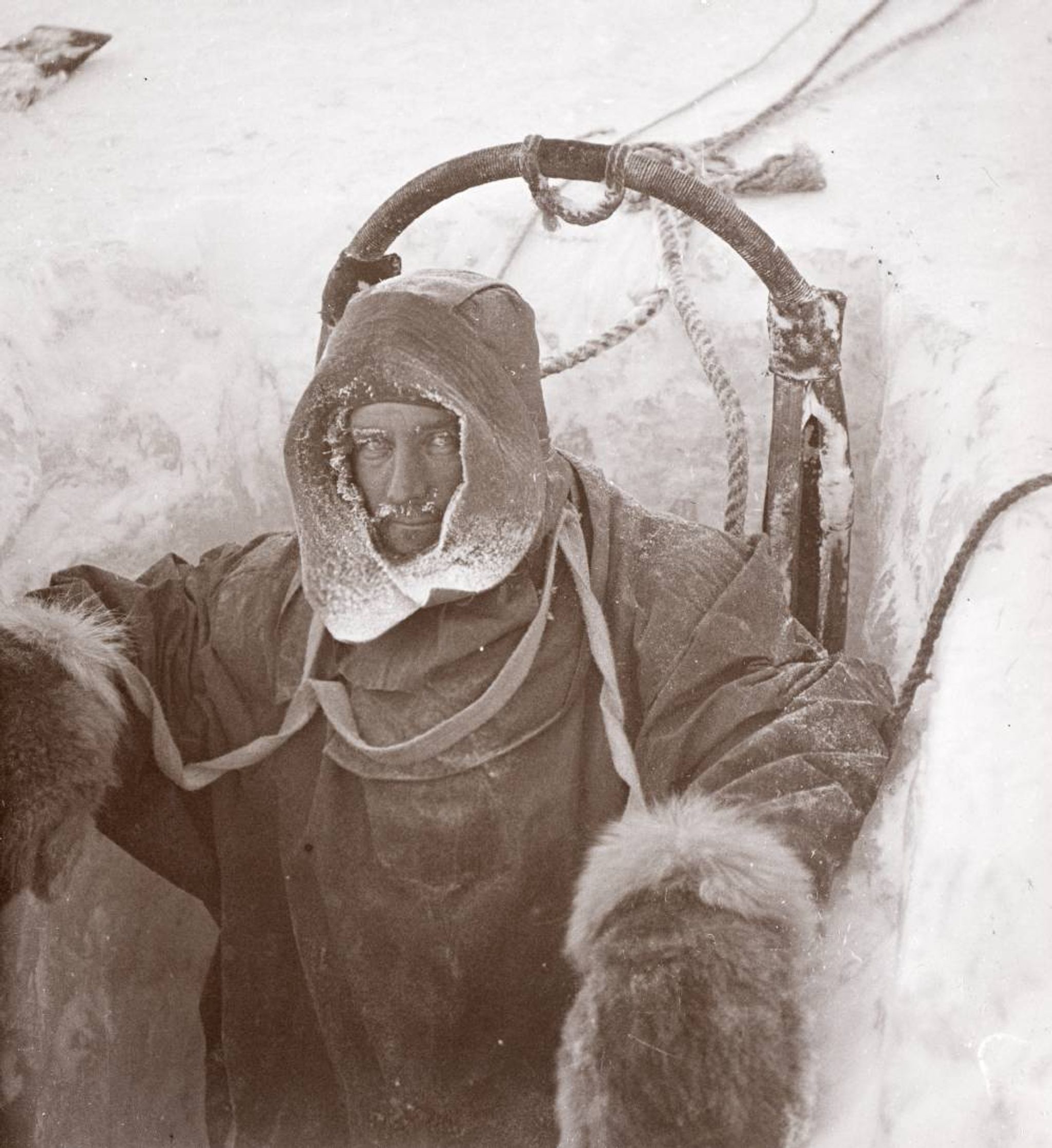 Man in Antarctica (hole in ice)