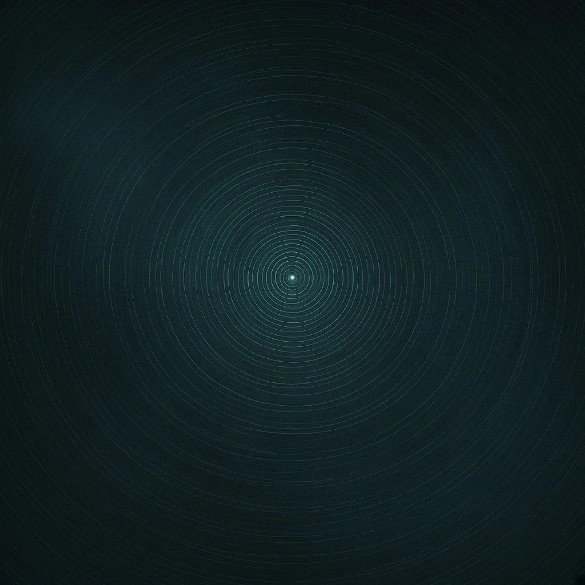 Abstract cover art: near-black concentric contour rings receding toward one pale cyan point, where scattered qualitative signals resolve into one answer.