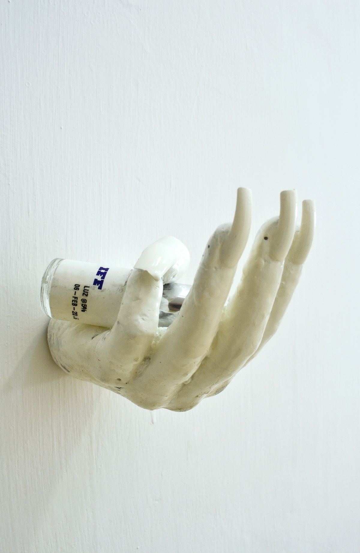 Dorota Gawęda and Eglė Kulbokaitė, Can Ai feel a tansient gentle sadness?, 2016; CONCRETE, FAKE NAILS, NAIL JEWELRY, ACRYLIC PAINT, IFF BOTTLE [PRODUCED IN COLLABORATION WITH CLEMENCE DE LA TOUR DU PIN AND INTERNATIONAL FLAVOURS AND FRAGRANCES INC. NEW YORK] (13 x 7 x 7 cm)