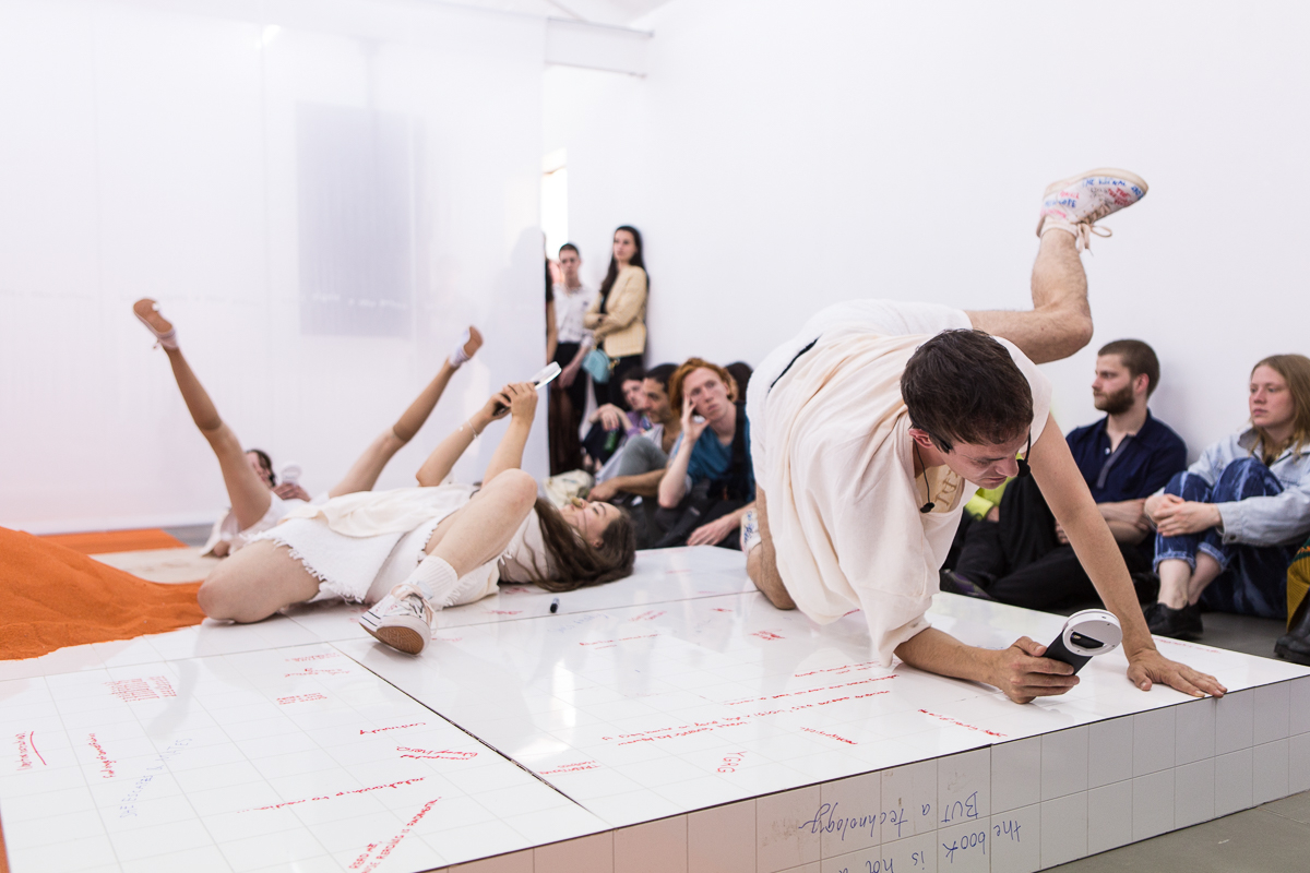 DOROTA GAWĘDA & EGLĖ KULBOKAITĖ, YGRG 14X: readibg with a single hand V , 2018.  Performance at Cell Project Space, London.