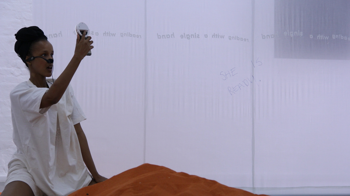 DOROTA GAWĘDA & EGLĖ KULBOKAITĖ, YGRG 14X: readibg with a single hand V , 2018.  Performance at Cell Project Space, London.