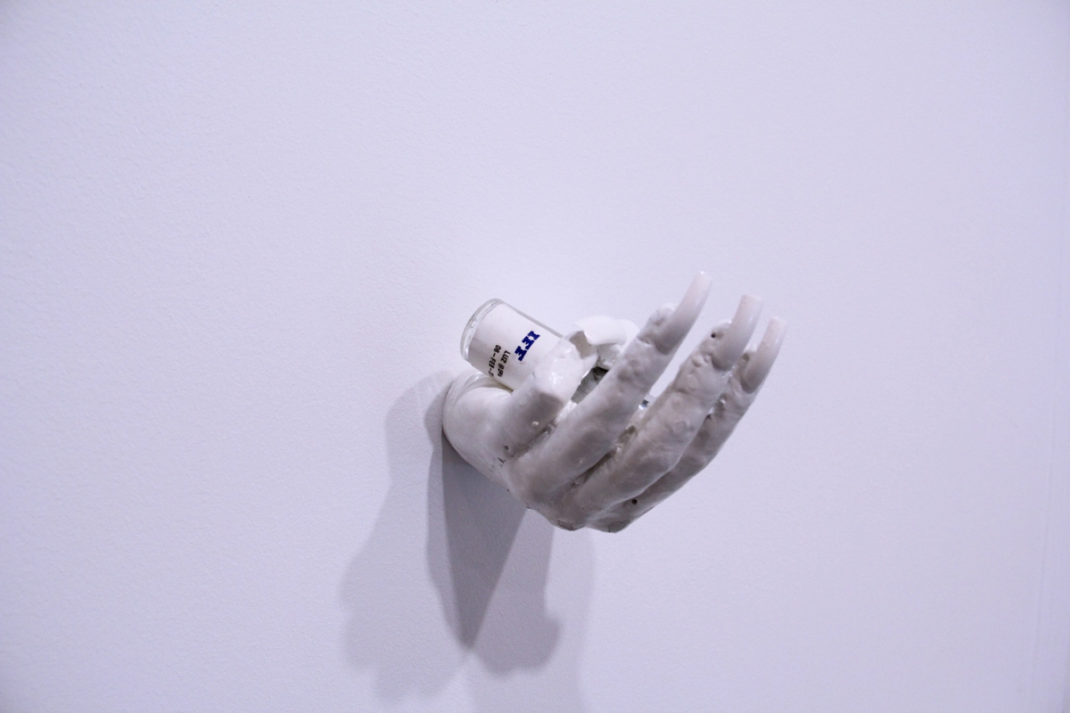  Can Ai feel a tansient gentle sadness?, 2016

 CONCRETE, FAKE NAILS, NAIL JEWELRY, ACRYLIC PAINT, IFF BOTTLE [PRODUCED IN COLLABORATION WITH CLEMENCE DE LA TOUR DU PIN AND INTERNATIONAL FLAVOURS AND FRAGRANCES INC. NEW YORK] (13 x 7 x 7 cm)