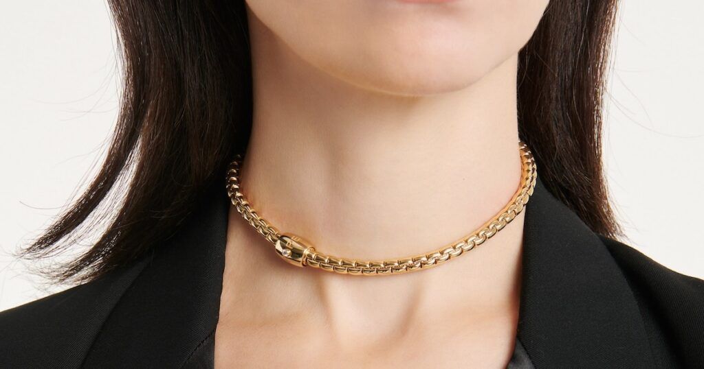Layered gold chain necklaces displaying timeless luxury jewelry styling