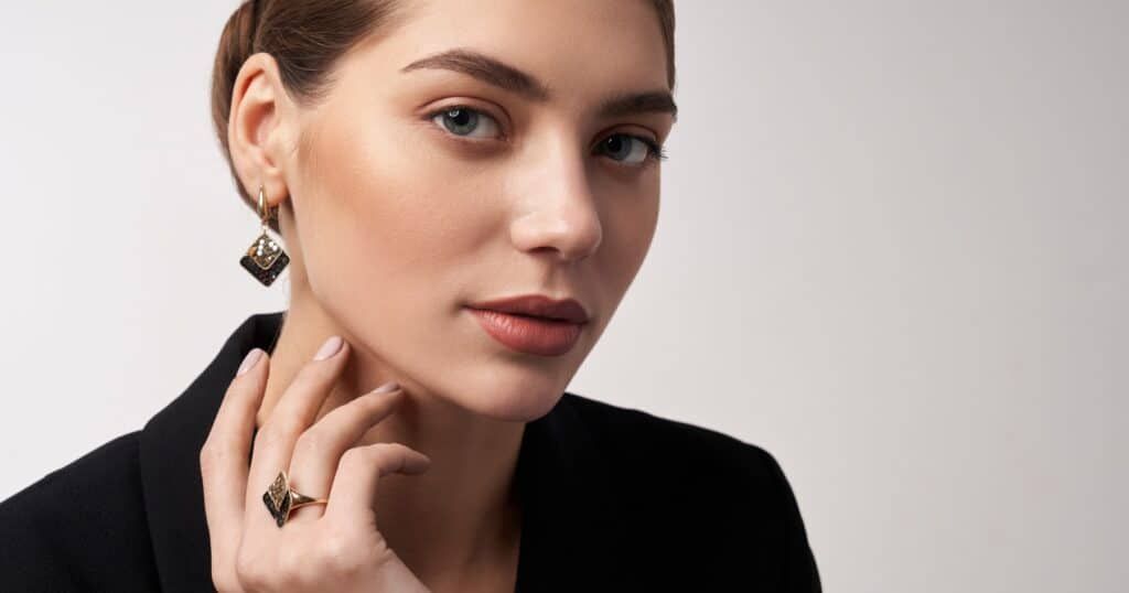 Careful handling of delicate luxury jewelry to prevent damage to settings and prongs