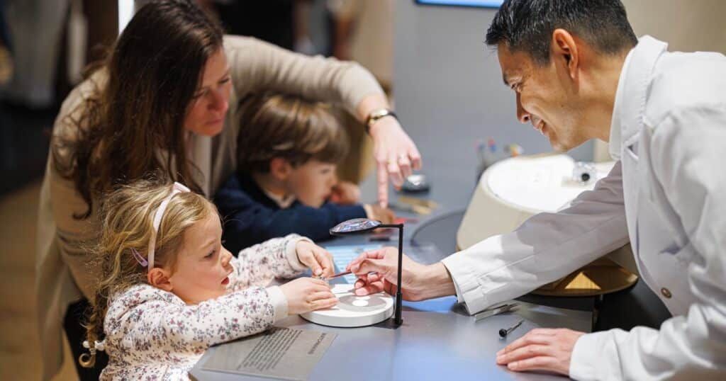 Master watchmaker demonstrating traditional craftsmanship at Watches and Wonders 2025