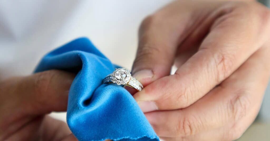 Luxury jewelry cleaning with soft brush and solution for maintaining fine pieces