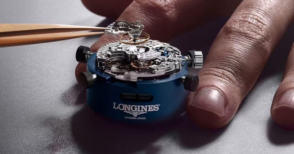 Moisture condensation visible inside luxury Omega Seamaster watch dial requiring immediate service