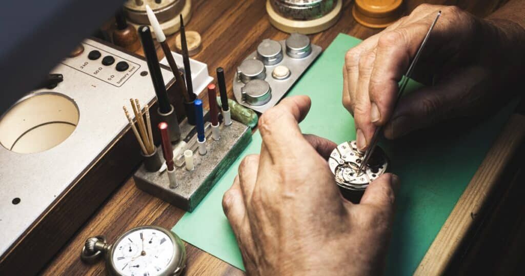 Certified watchmaker performing precision maintenance on luxury timepiece in Canada