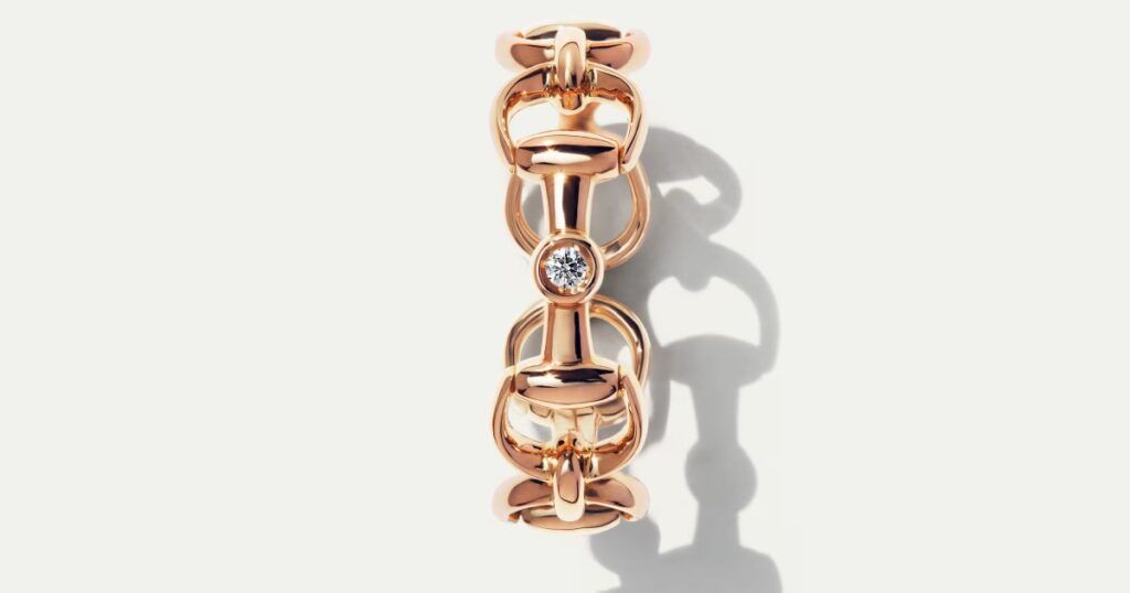 Luxury Gucci gold and silver jewelry collection pieces on display