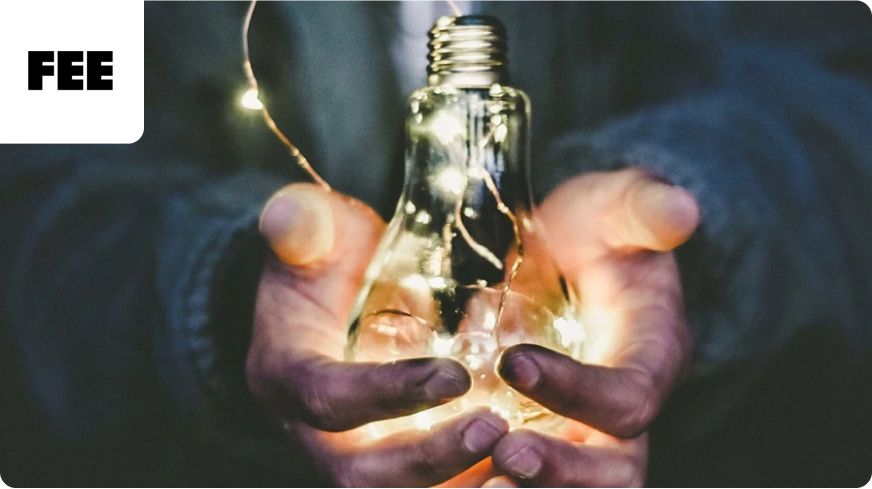 Hand holding a lightbulb