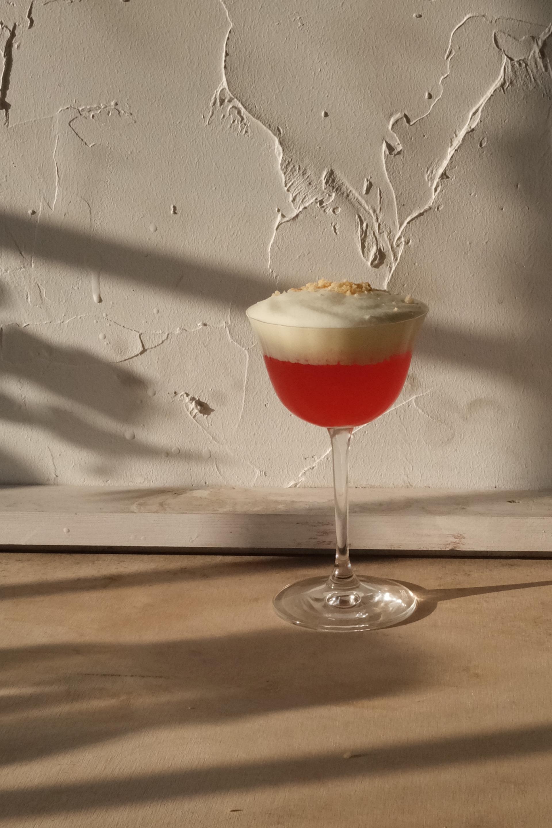 Bild på Hallondrinken Skrea Hallonpaj med gräddigt skum på toppen.