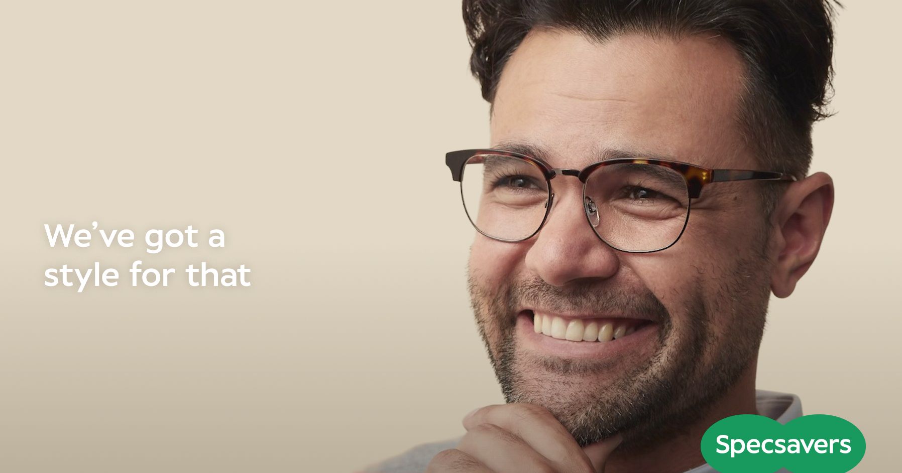 Specsavers campaign with text on the left reading "We've got a style for that" and Rory on the right smiling and wearing eyeglasses.