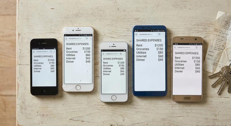 Overhead view of five mismatched phones laid out on a plain table, each showing the same shared expense list in a web browser, no app icons anywhere