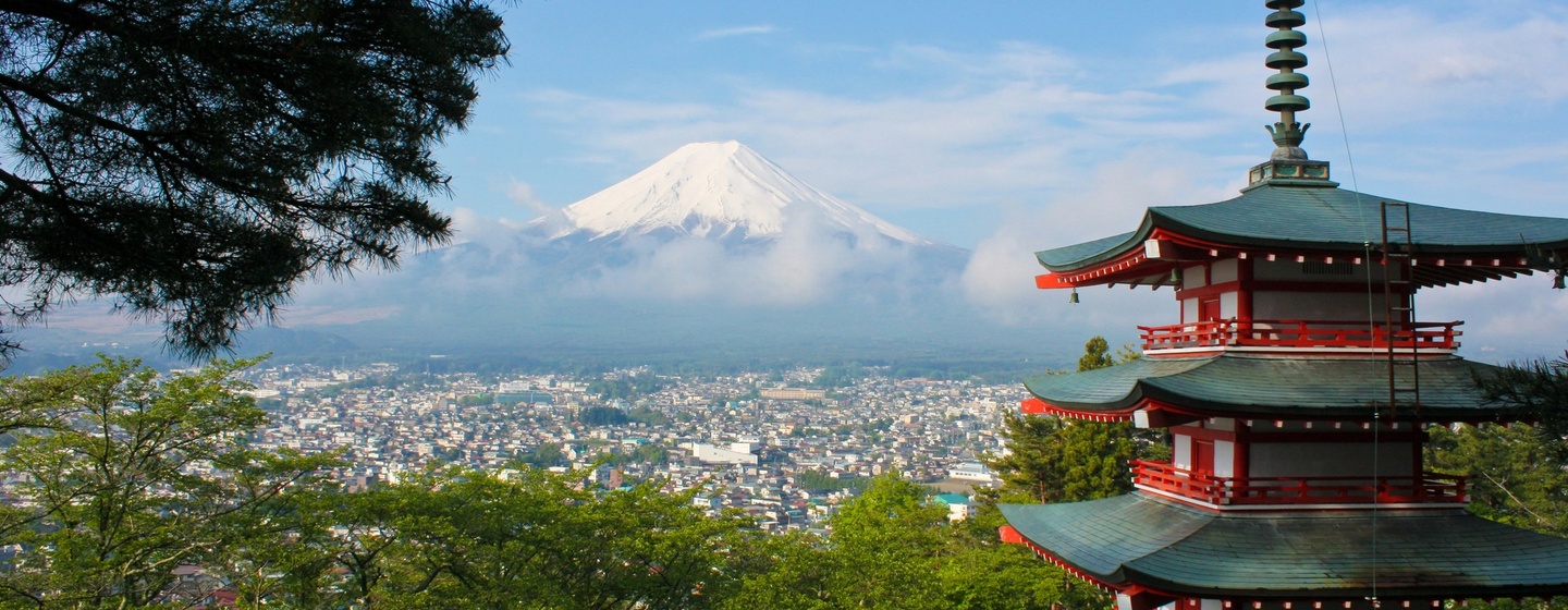 Mt. Fuji rising in the background of a pagoda