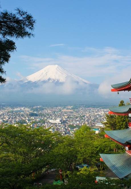 Mt. Fuji rising in the background of a pagoda