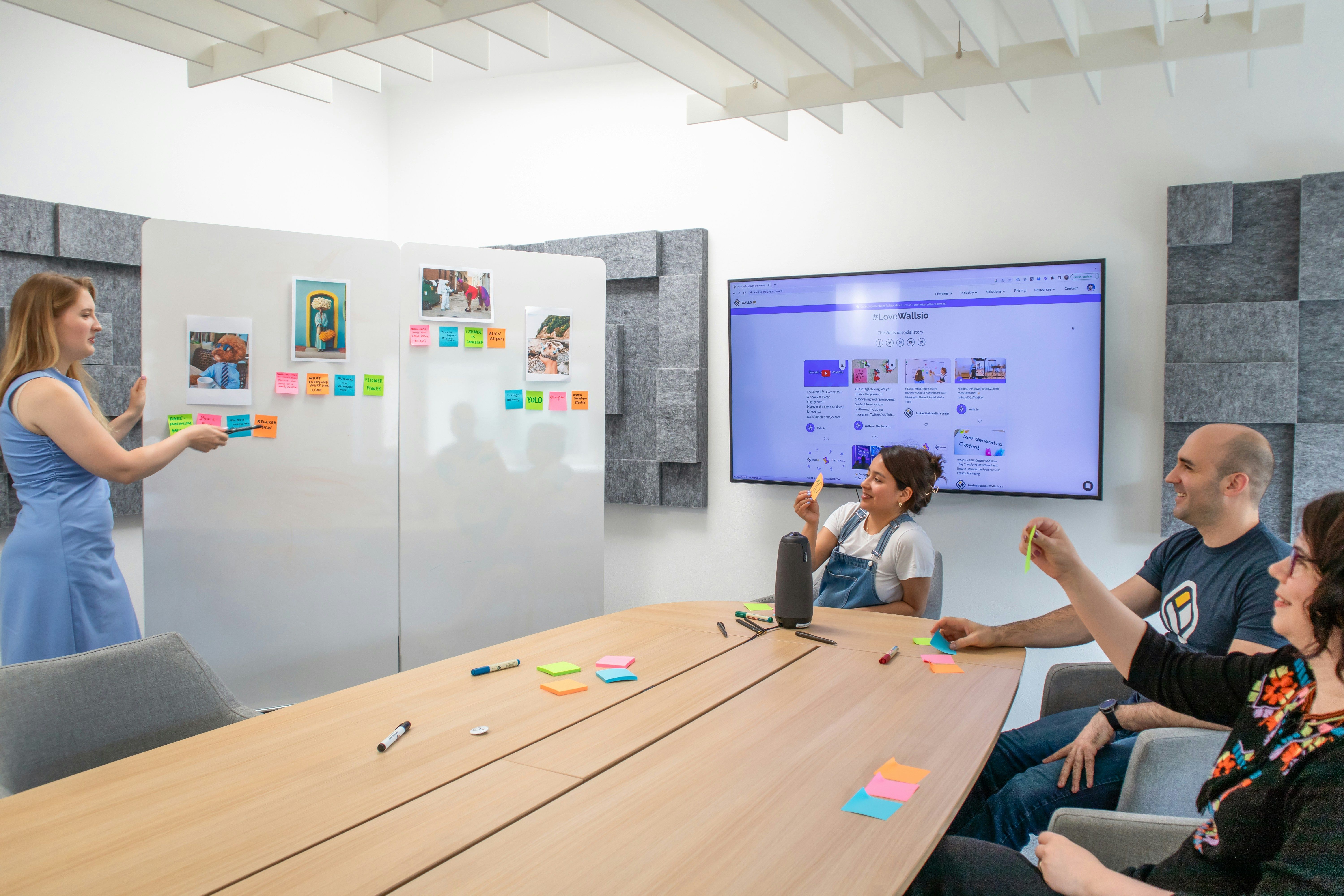 Product manager presenting product features to the team during a sales kickoff.